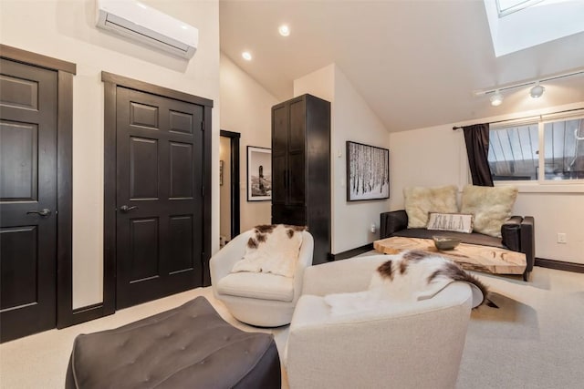 living area featuring carpet, vaulted ceiling with skylight, baseboards, and a wall mounted AC