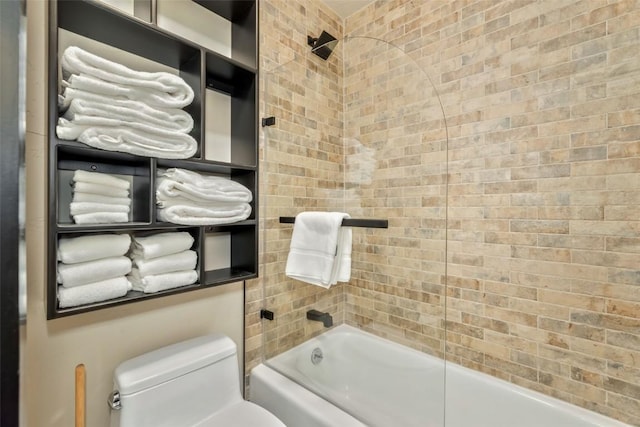 bathroom featuring shower / bath combination and toilet