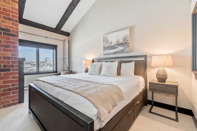 bedroom with baseboards, vaulted ceiling, and light colored carpet