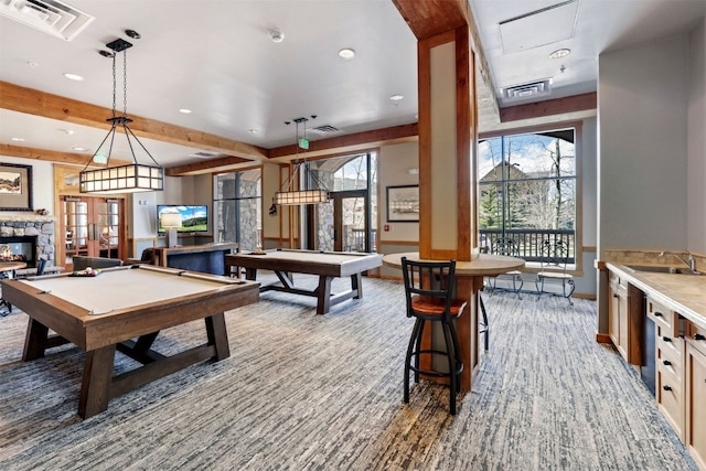 rec room featuring carpet floors, sink, pool table, and a fireplace