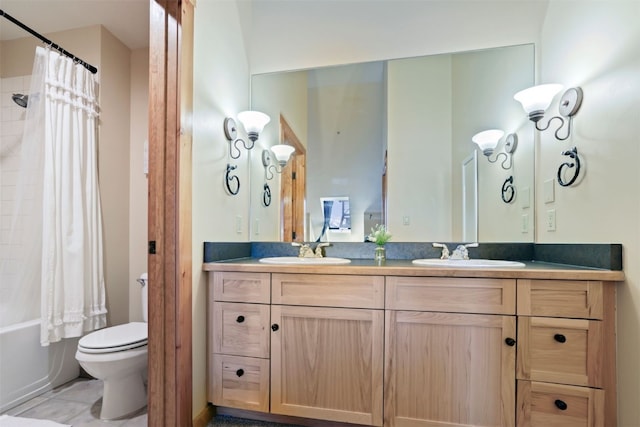 full bathroom featuring vanity, toilet, tile patterned flooring, and shower / tub combo