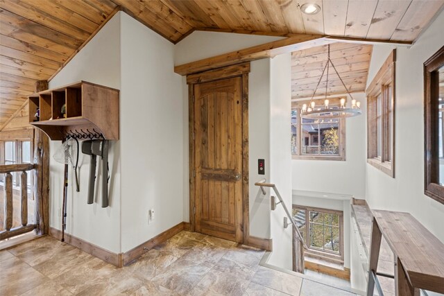 interior space featuring a chandelier, wood ceiling, and lofted ceiling