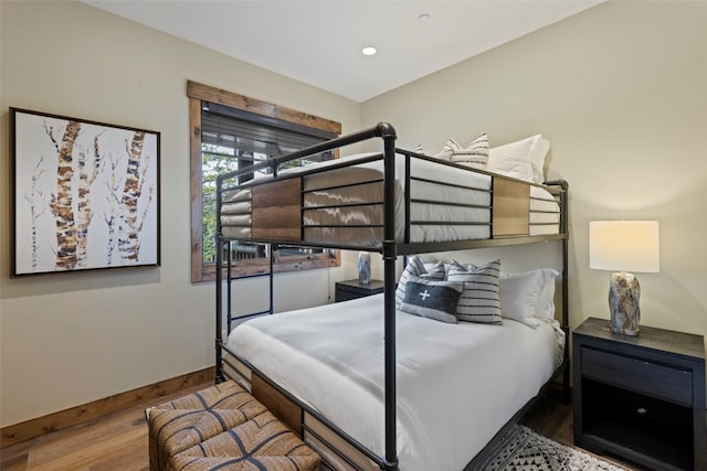 bedroom with hardwood / wood-style floors