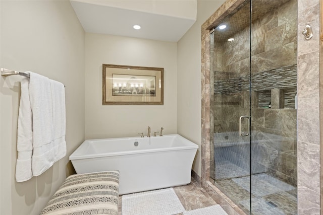 bathroom featuring tile patterned flooring and shower with separate bathtub