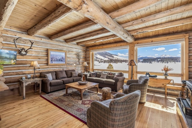 living room with a baseboard radiator, rustic walls, wood ceiling, light wood-type flooring, and beamed ceiling