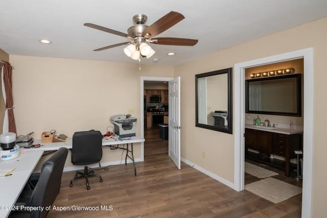 office with hardwood / wood-style flooring, ceiling fan, and sink