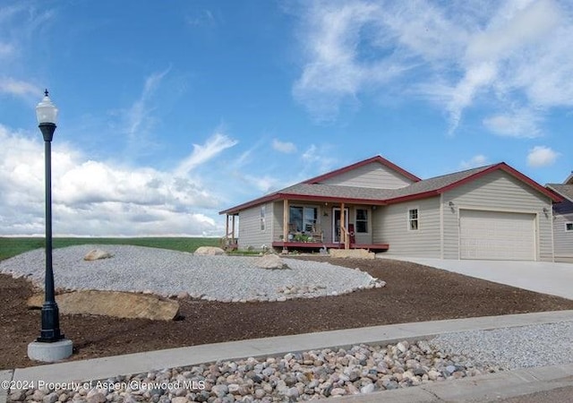 view of front facade with a porch and a garage