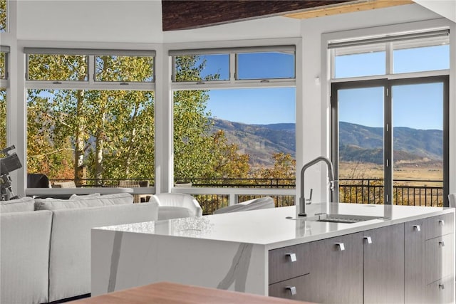 interior space with a mountain view and sink