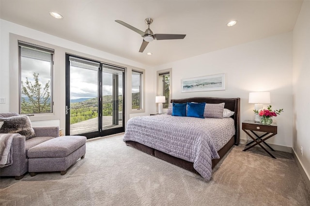 bedroom with carpet flooring, ceiling fan, and access to exterior