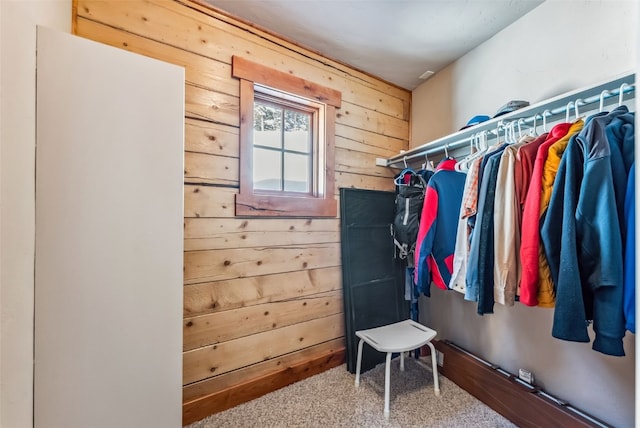 walk in closet featuring carpet