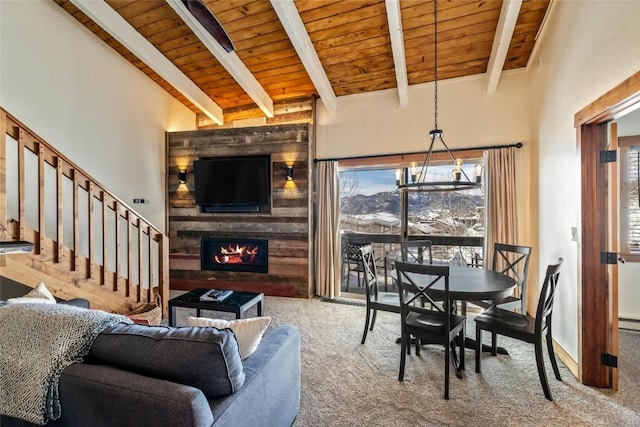 carpeted living room featuring beam ceiling, wood ceiling, high vaulted ceiling, a baseboard radiator, and a fireplace