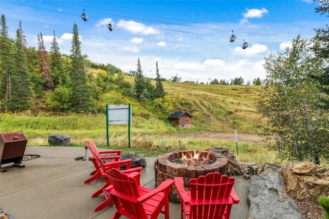 view of patio featuring a fire pit