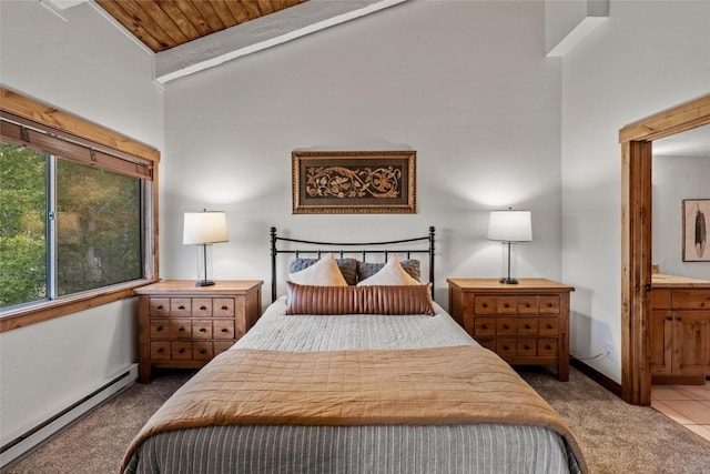 carpeted bedroom with vaulted ceiling, a baseboard heating unit, wooden ceiling, and ensuite bath