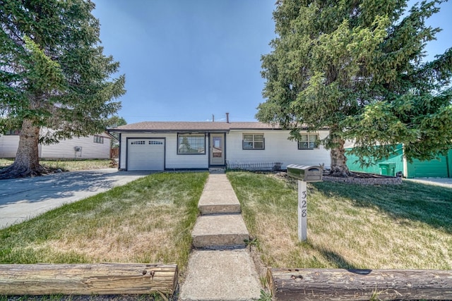 ranch-style home with a garage and a front lawn