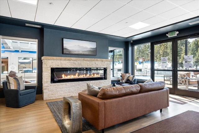 living room featuring a fireplace and light hardwood / wood-style floors