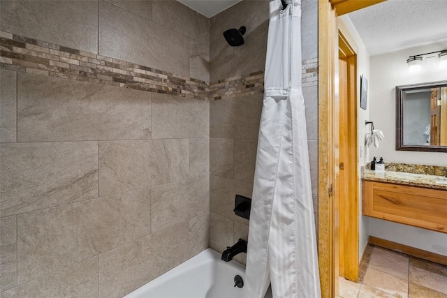 bathroom with vanity, a textured ceiling, and shower / bath combo with shower curtain