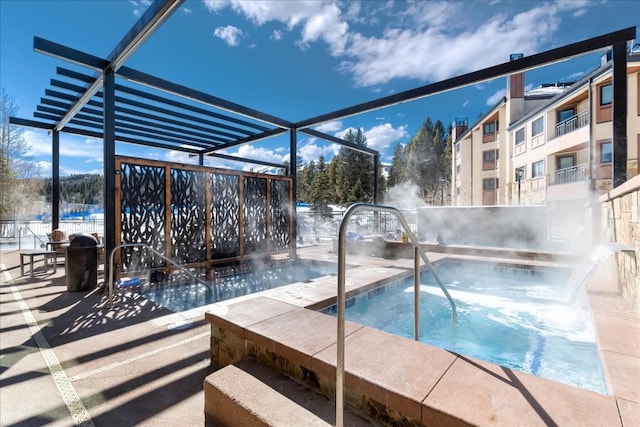 view of pool with a community hot tub