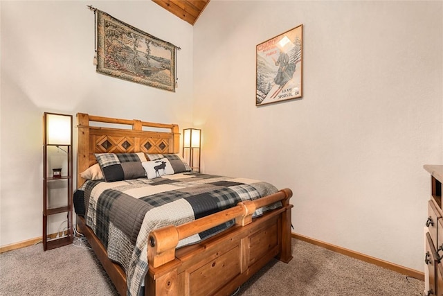 bedroom featuring light carpet, wood ceiling, and lofted ceiling