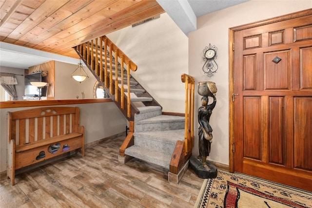 interior space with wood ceiling and hardwood / wood-style flooring