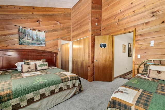 bedroom with wooden walls and carpet