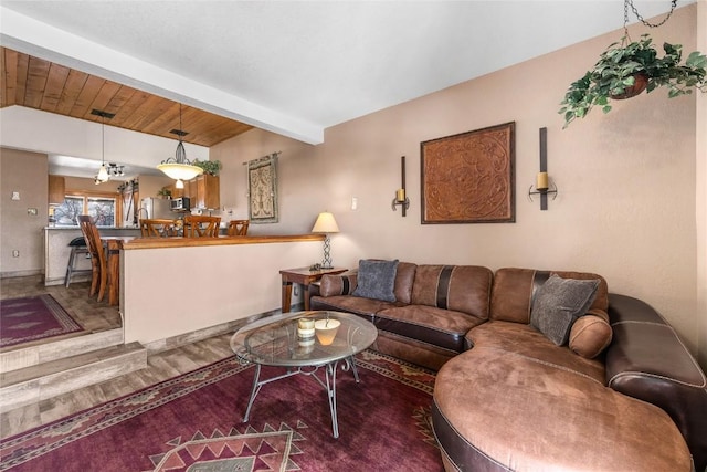 living room featuring beam ceiling, wood ceiling, and wood-type flooring