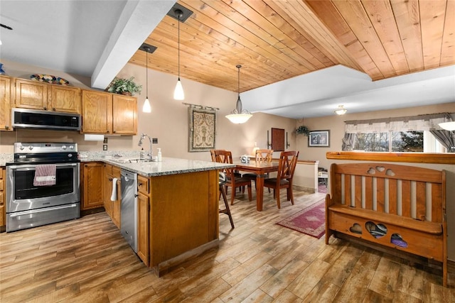 kitchen featuring light stone countertops, hanging light fixtures, stainless steel appliances, kitchen peninsula, and wood ceiling