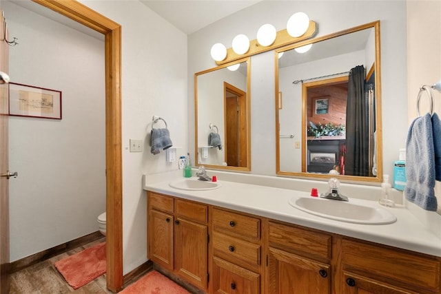 bathroom featuring vanity and toilet