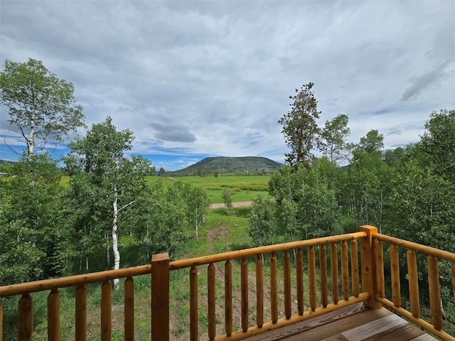 wooden terrace featuring a mountain view