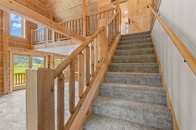 stairway with a towering ceiling