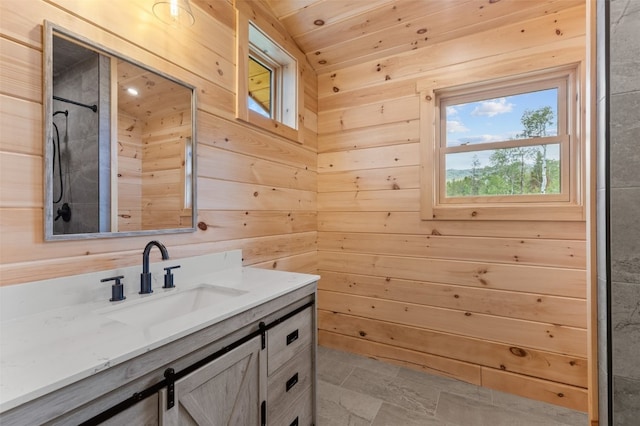 bathroom with vanity, wood walls, and a shower