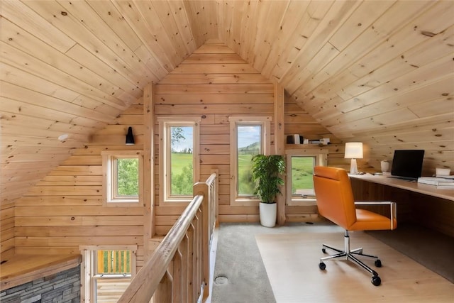 unfurnished office featuring lofted ceiling, light colored carpet, wood ceiling, and wooden walls