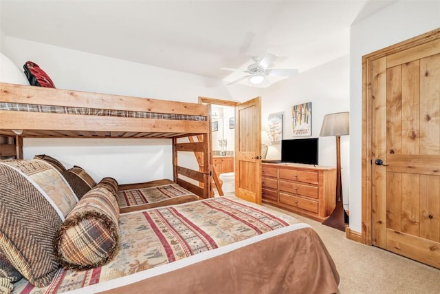 bedroom featuring carpet flooring, ceiling fan, and connected bathroom