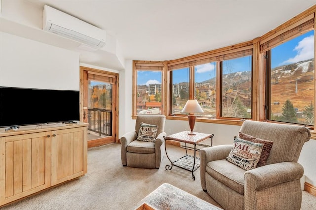 sunroom with a mountain view and a wall unit AC