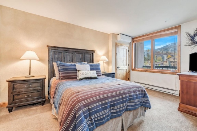 bedroom with baseboard heating, a wall mounted AC, and light colored carpet