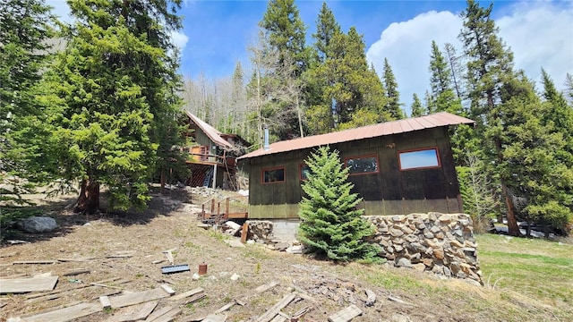 view of side of home with an outbuilding