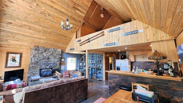 living room featuring a wood stove, beamed ceiling, high vaulted ceiling, dark hardwood / wood-style floors, and a notable chandelier