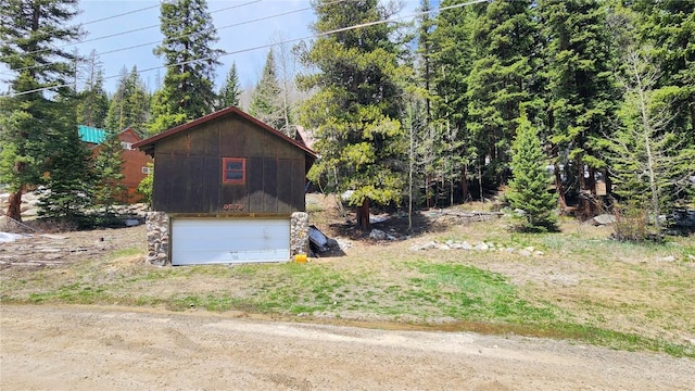 view of side of property featuring a garage