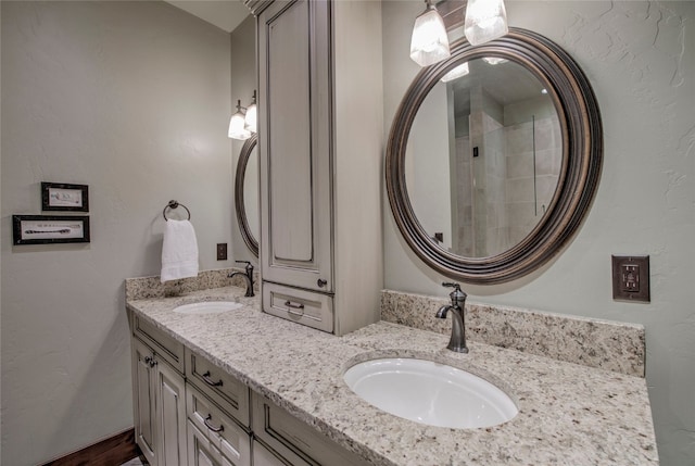 bathroom featuring a sink and double vanity