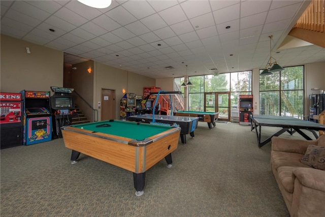 recreation room with pool table, floor to ceiling windows, and carpet