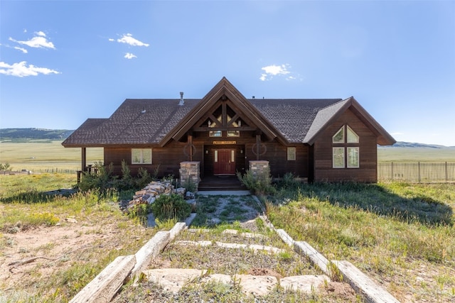 view of front of property with a rural view