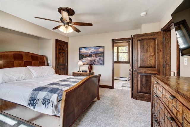 bedroom with baseboard heating, ceiling fan, and light carpet