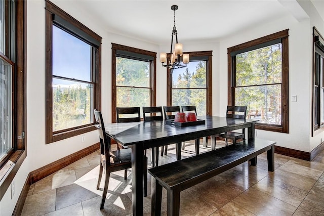 dining space featuring a chandelier