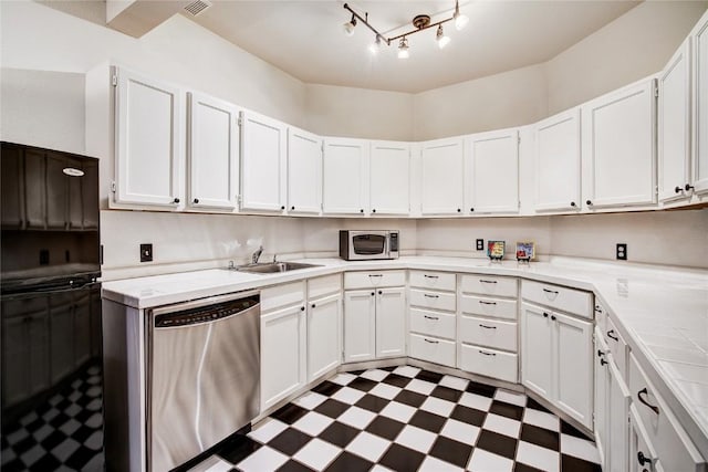 kitchen featuring white cabinetry, sink, and appliances with stainless steel finishes