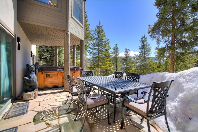 view of patio / terrace with a hot tub