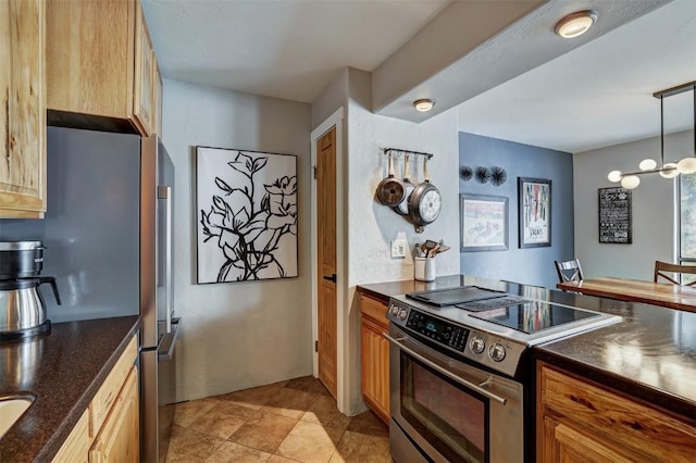 kitchen with hanging light fixtures, appliances with stainless steel finishes, and a notable chandelier