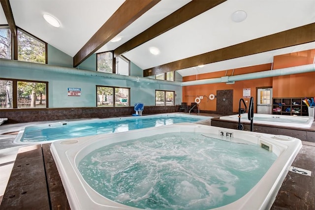 view of pool with an indoor hot tub