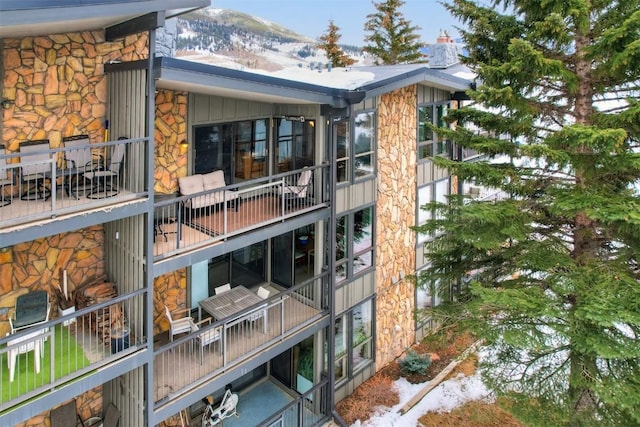 snow covered property with a mountain view