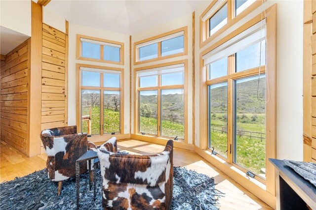 sunroom / solarium featuring a healthy amount of sunlight