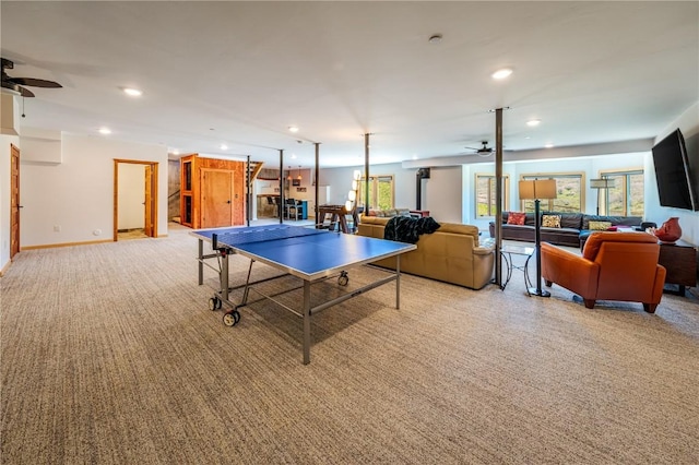 playroom featuring light colored carpet and ceiling fan