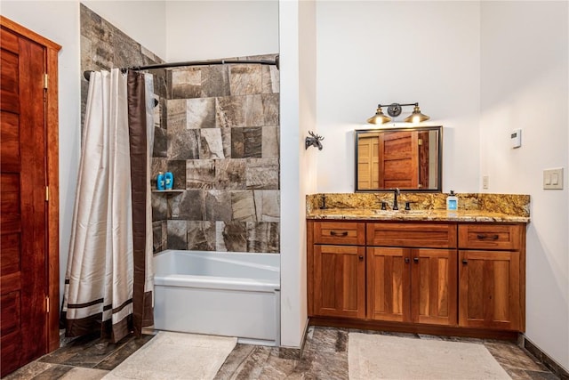 bathroom featuring vanity and shower / tub combo